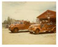 Some of our old trucks in front of our original fire station located at its current site 207 N. Second Street.